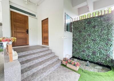 entryway with greenery