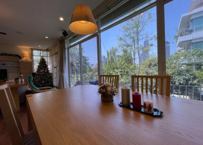 Spacious dining area with large windows and natural light