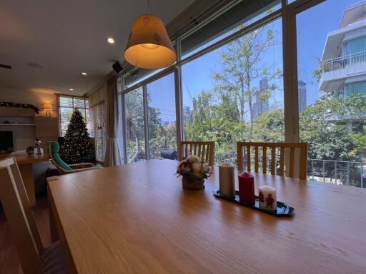 Spacious dining area with large windows and natural light