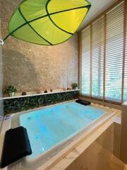 luxurious bathroom with a large jacuzzi tub