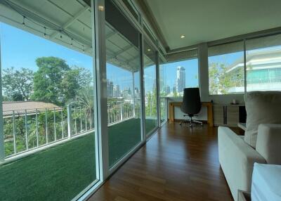 Bright living area with large windows and balcony