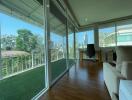 Bright living area with large windows and balcony