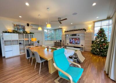 modern living room with dining area and Christmas decorations