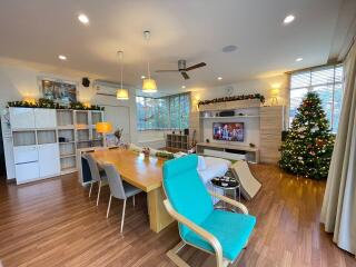 modern living room with dining area and Christmas decorations