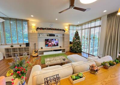 Spacious living room with modern decor and natural lighting