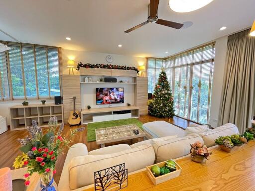 Spacious living room with modern decor and natural lighting