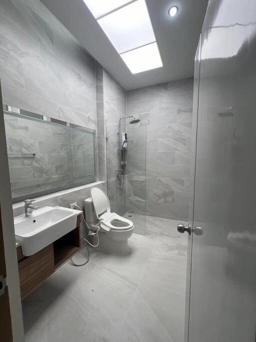 Modern bathroom with shower and skylight