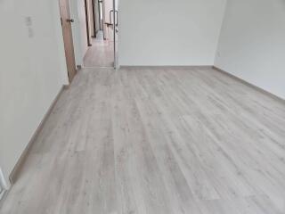 Empty bedroom with wood-like flooring