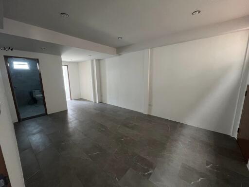 Empty living room with tiled floor