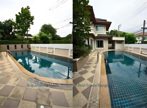 Outdoor swimming pool area with tiled flooring and surrounding greenery