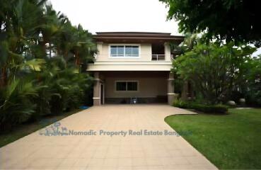 Front view of a two-story house with driveway