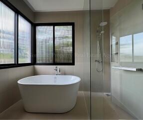 Modern bathroom with bathtub and shower