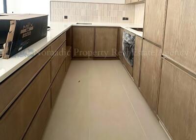 Modern kitchen with wooden cabinets and tiled backsplash