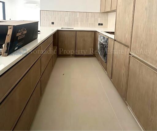 Modern kitchen with wooden cabinets and tiled backsplash