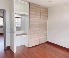 Bedroom with wardrobe and vanity