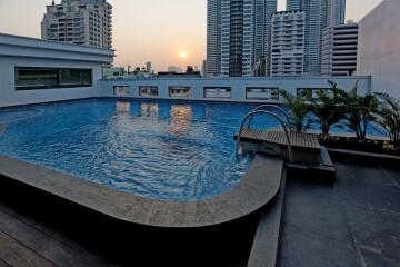 Rooftop swimming pool with city skyline view