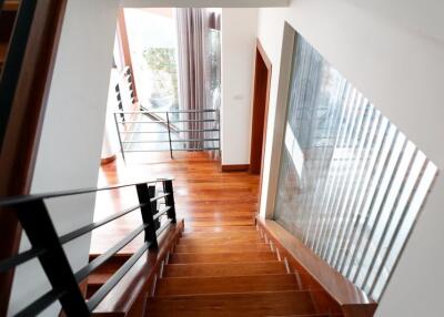 Elegant wooden staircase with modern railing