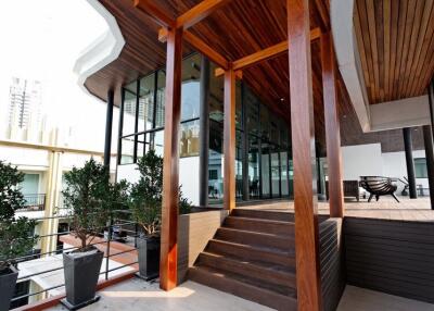 Modern terrace with wooden elements and large windows