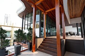 Modern terrace with wooden elements and large windows