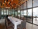 Elegant dining area with large windows and pool view