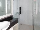 Modern bathroom with glass shower and vessel sink