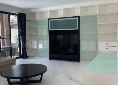 Modern living room with TV and shelving