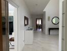 Modern hallway with white walls and tiled floor