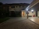 Exterior view of the property from the driveway at dusk