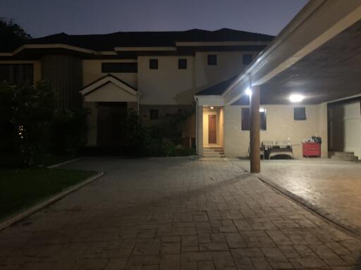 Exterior view of the property from the driveway at dusk