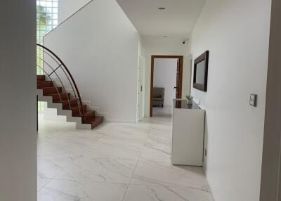 Spacious modern hallway with staircase