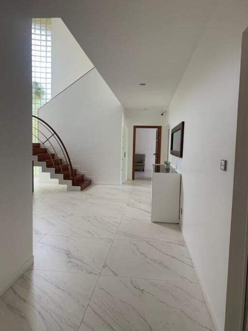 Spacious modern hallway with staircase