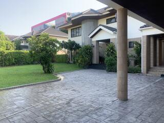 Front view of a modern house with a well-maintained yard