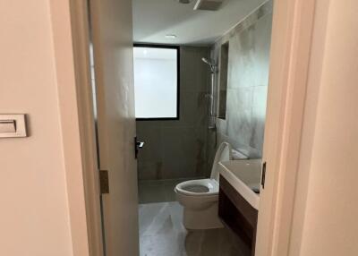 Bathroom showing toilet, sink, and shower