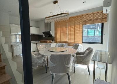 Modern dining area with a round table and chairs