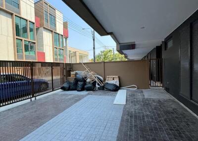 Outdoor area with building and cars