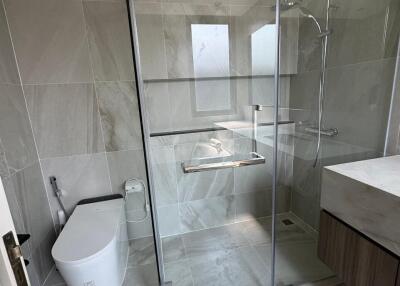 Modern bathroom with glass shower and toilet