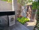 Private outdoor garden with utility storage