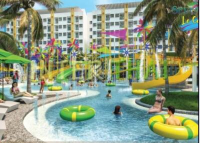 Colorful outdoor recreational pool area with people swimming and colorful water features