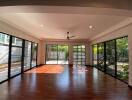 Spacious living room with large windows and garden view