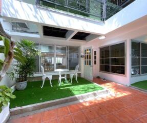 Outdoor patio with furniture and plants