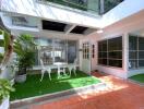 Outdoor patio with furniture and plants