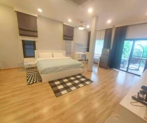 Spacious bedroom with hardwood floors