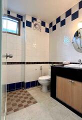 Modern bathroom with white and blue tiles