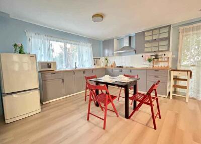 Spacious kitchen with modern appliances and dining area