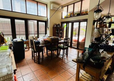 Spacious kitchen with dining area and large windows