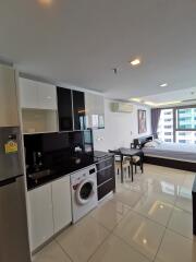 Modern studio apartment with open kitchen and living area