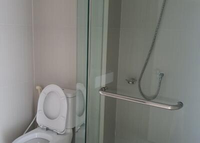 Modern bathroom with toilet and glass shower enclosure