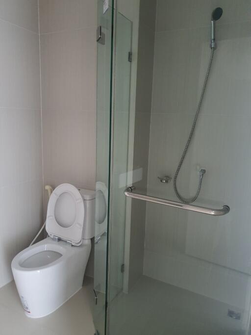 Modern bathroom with toilet and glass shower enclosure