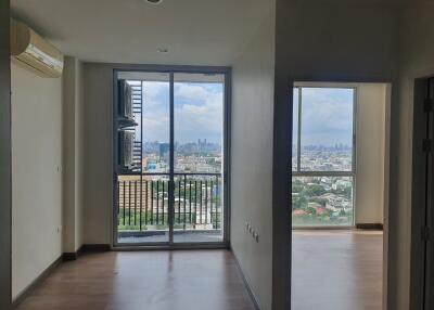 Living space with large windows and city view