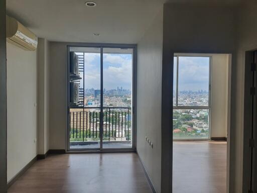 Living space with large windows and city view